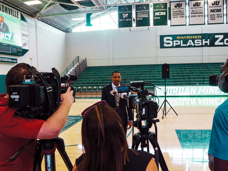 JU Sport Business student being interviewed in the JU gymnasium.