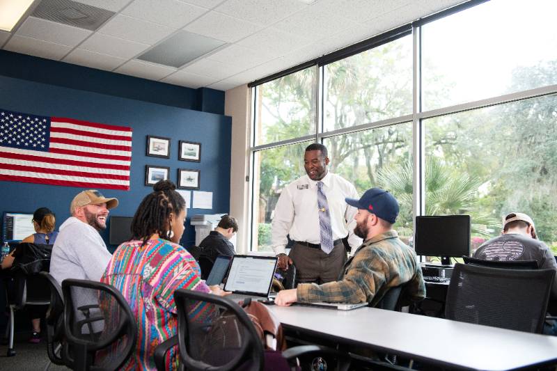 Veteran students learning inside the Defenders Den on campus.