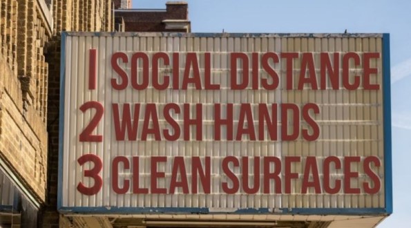 A sign that says 1 social distance 2 wash hands 3 clean surfaces.