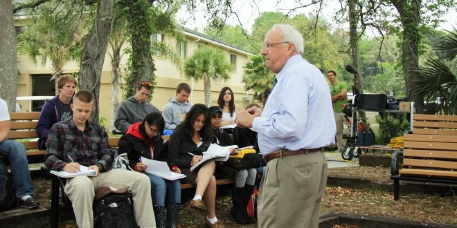 Dr. White teaching students in the outdoor classroom on campus. 