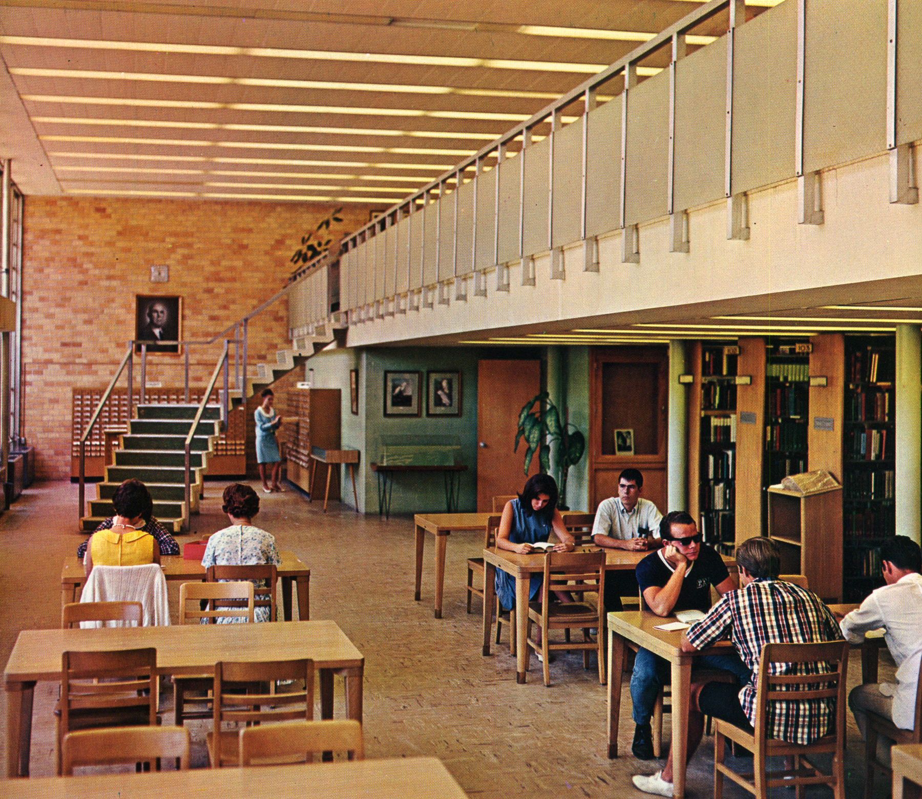 Archival photo of students in the Swisher Library in 1967