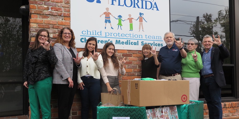 People in front of building with boxes