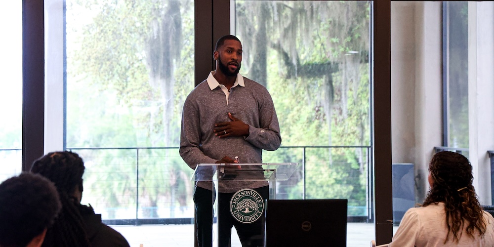 Michael Kidd-Gilchrist speaking at podium