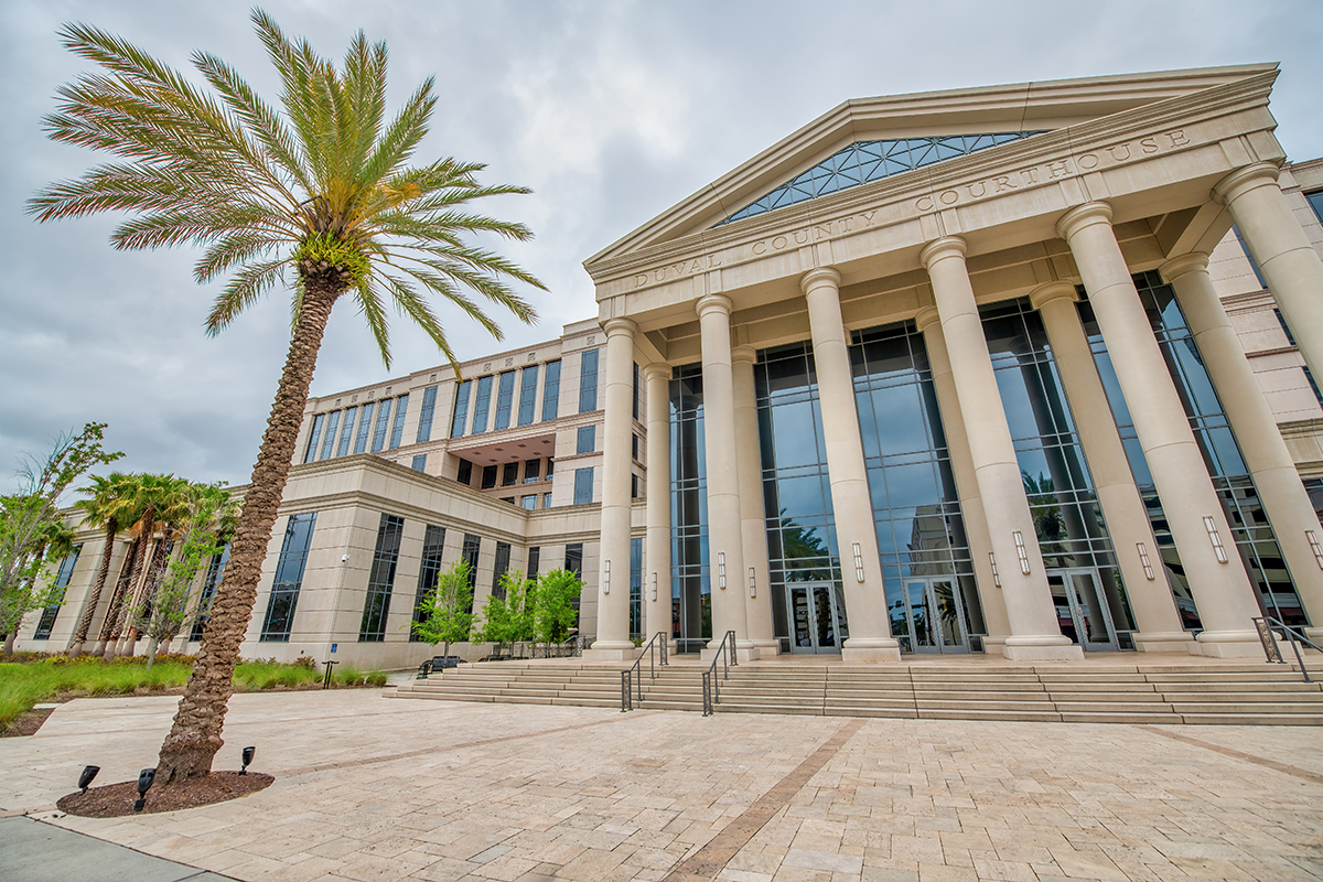 Front entrance of Duval County court house with palm trees