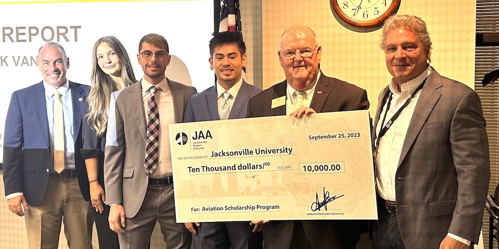 Man holding giant check