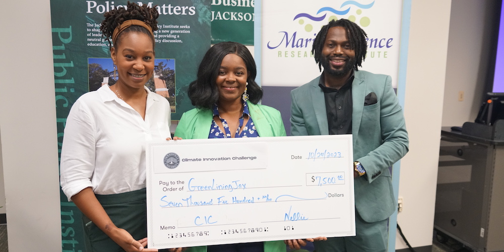 People holding giant check