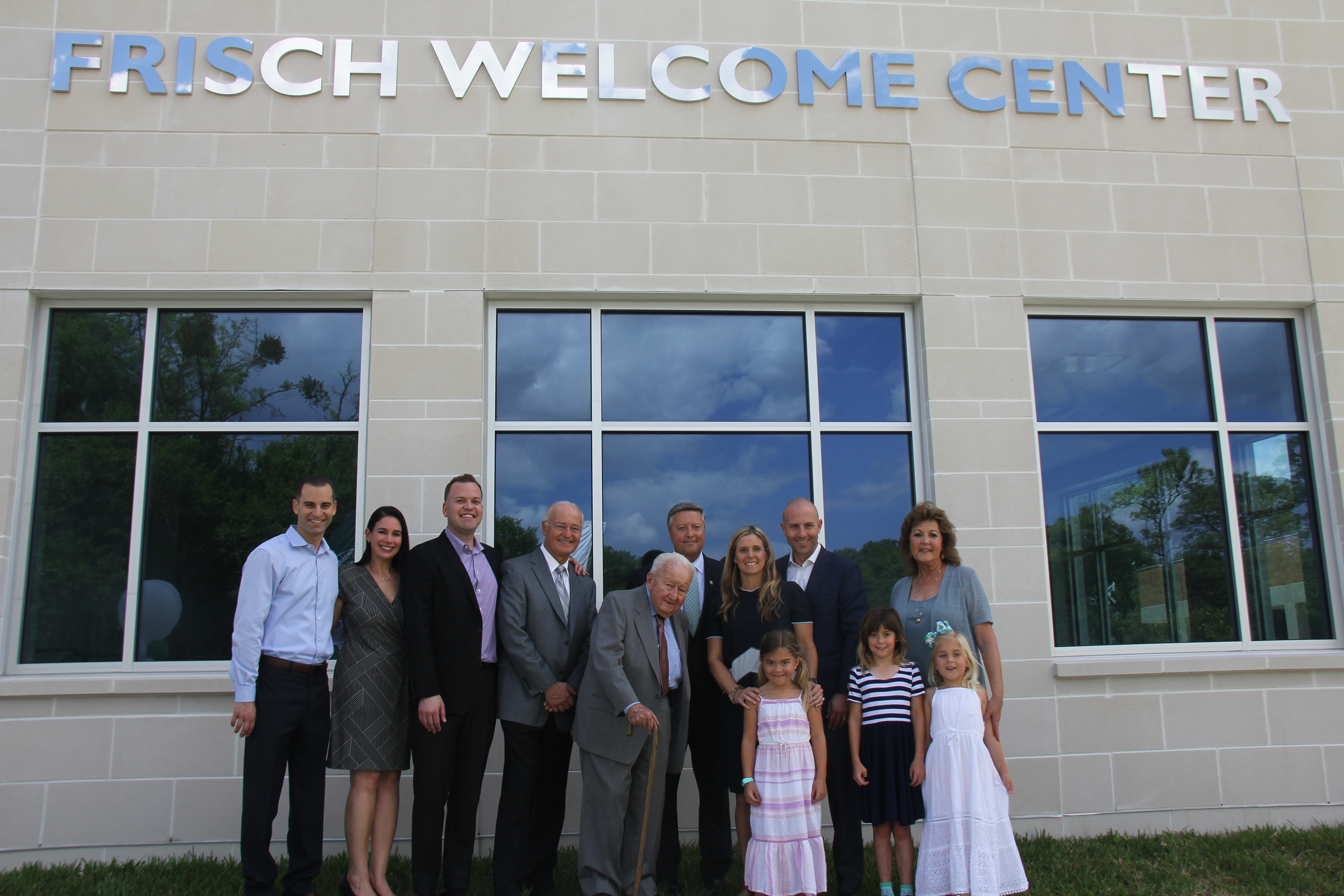 Jacksonville University Supporters posing in front of Frisch Welcome Center