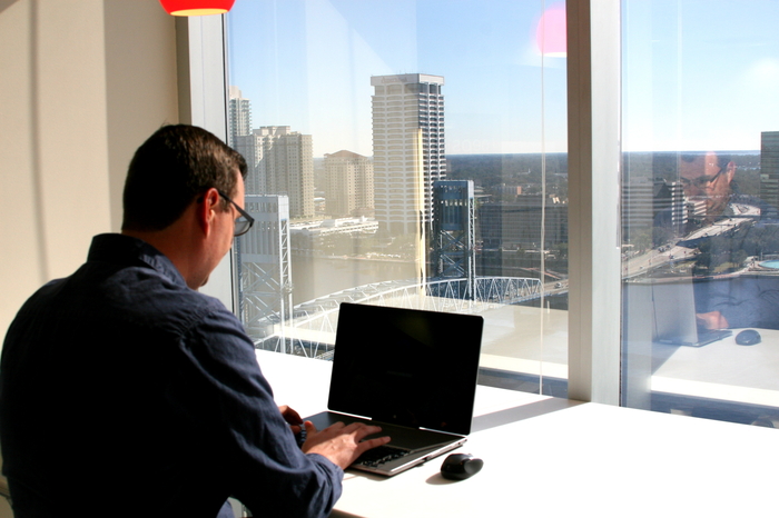 A student sitting at his laptop computer.