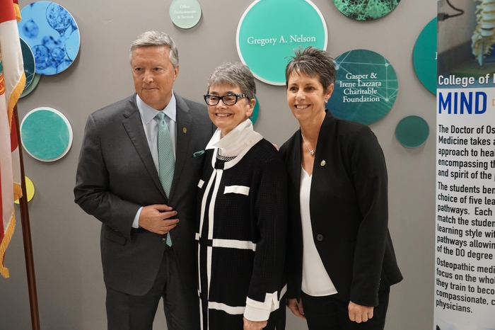 Dr. Christine Sapienza, Dr. Silvia Ferretti, and President Tim Cost pose for a photo