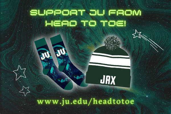 A pair of socks with the JAX dolphin logo and a beanie with the JAX dolphin logo.