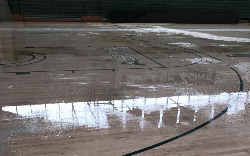 Standing water in Historic Swisher Gymnasium