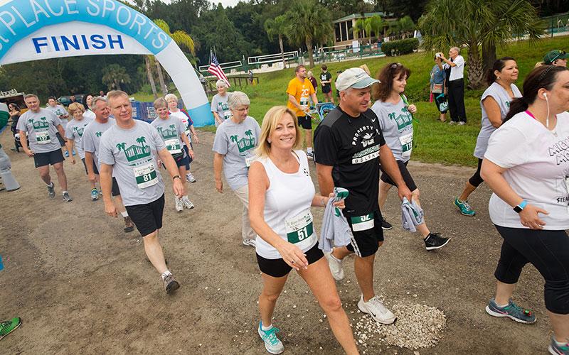 Walkers finishing the River House Run