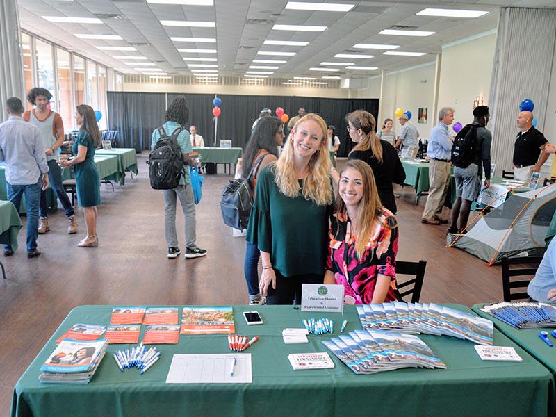 Two of our study abroad staff members smile for a picture.