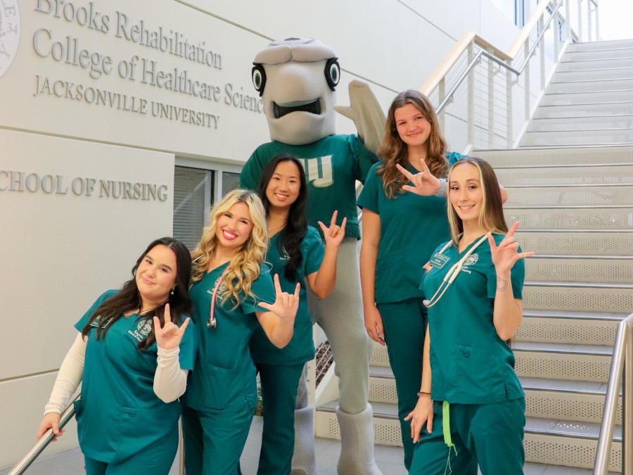 Nursing students with JU's mascot Dunk'n the Dolphin