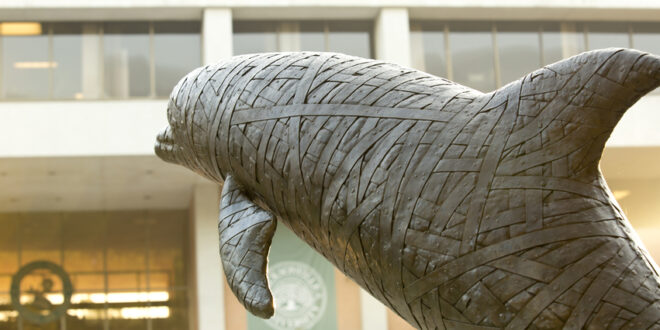 Jacksonville University Dolphin Statue behind the Howard Building.