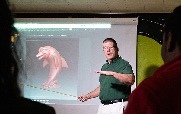 Professor Eric Kunzendorf points out features of ZBrush to a class of animation students.
