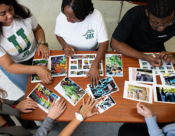 Photography students critiquing color digital photography in an Introductory class