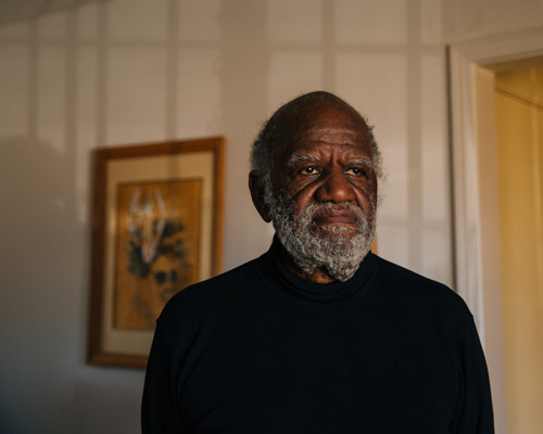 Portrait of Jack Guillebeauz in his living room late in the day 