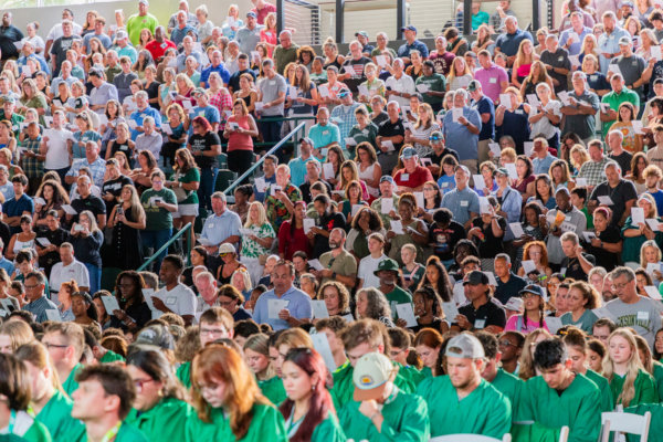 an aerial photo of the Swisher Gym seating area with students and parents during matriculation