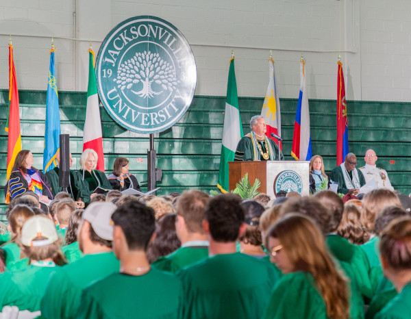 Incoming freshman sit facing President Cost as he performs the matriculation ceremony