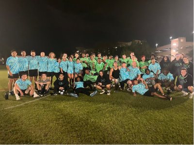 Jacksonville University Students in football field at night