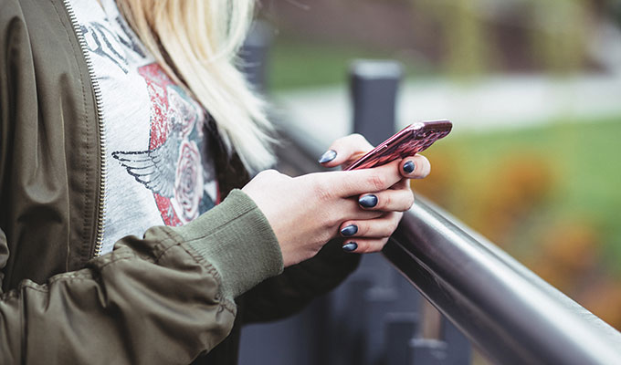 A girl holding a cell phone