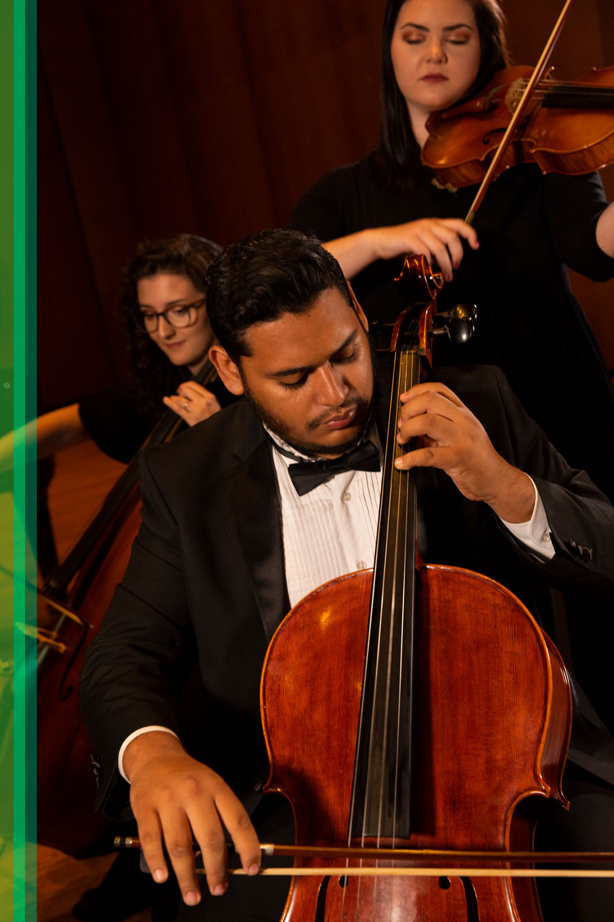 Three music students perform in Terry Concert Hall.