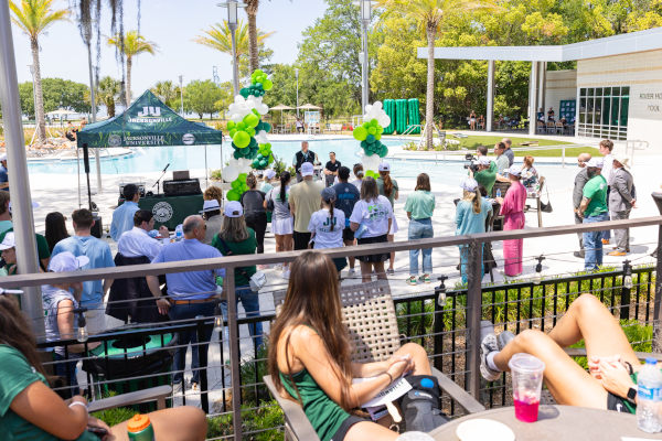 Charter Day volunteers gather for lunch at River Rouse Pool.