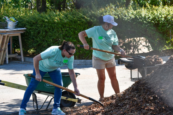 Volunteers work on cleaning up the University grounds.