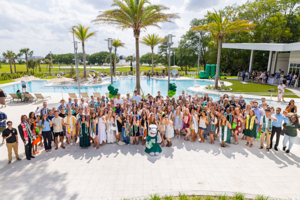 Charter Day Volunteers group photo in front of River House Swimming Pool