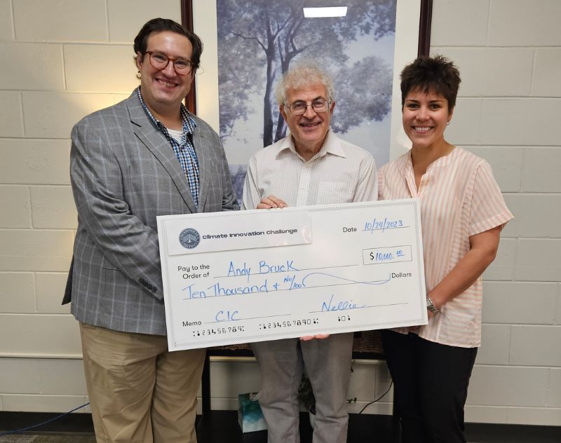 Andy Bruck, with his big check won for "Climate Crisis Poetry Contest for Duval County Public Schools High School Students."