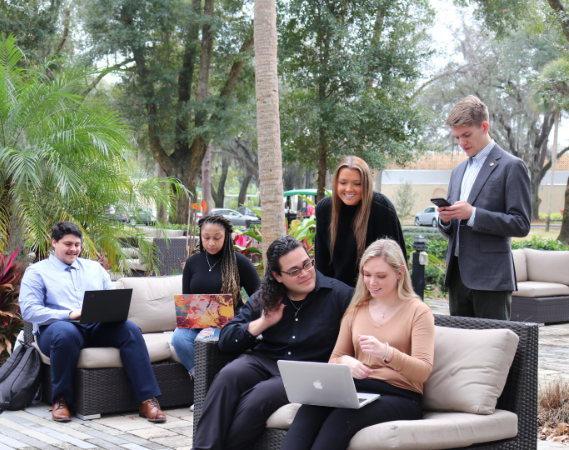 Prelaw and Preprofessional students sitting on the lawn  