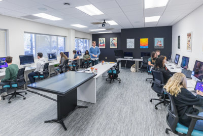 students seating at computer desks in an university lab