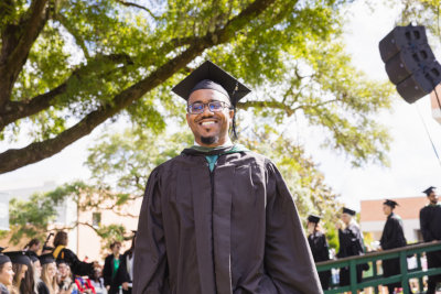 a student in graduation regalia