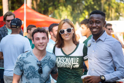JU students smiling to the camera outdoors