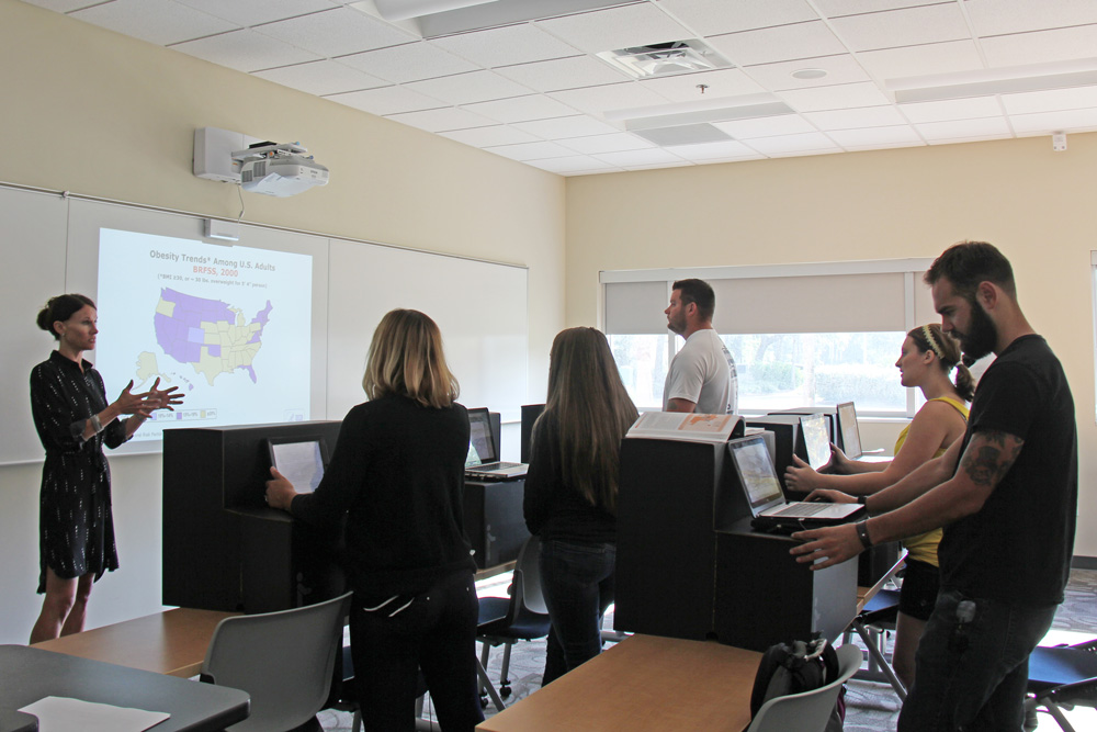 Students standing in class.