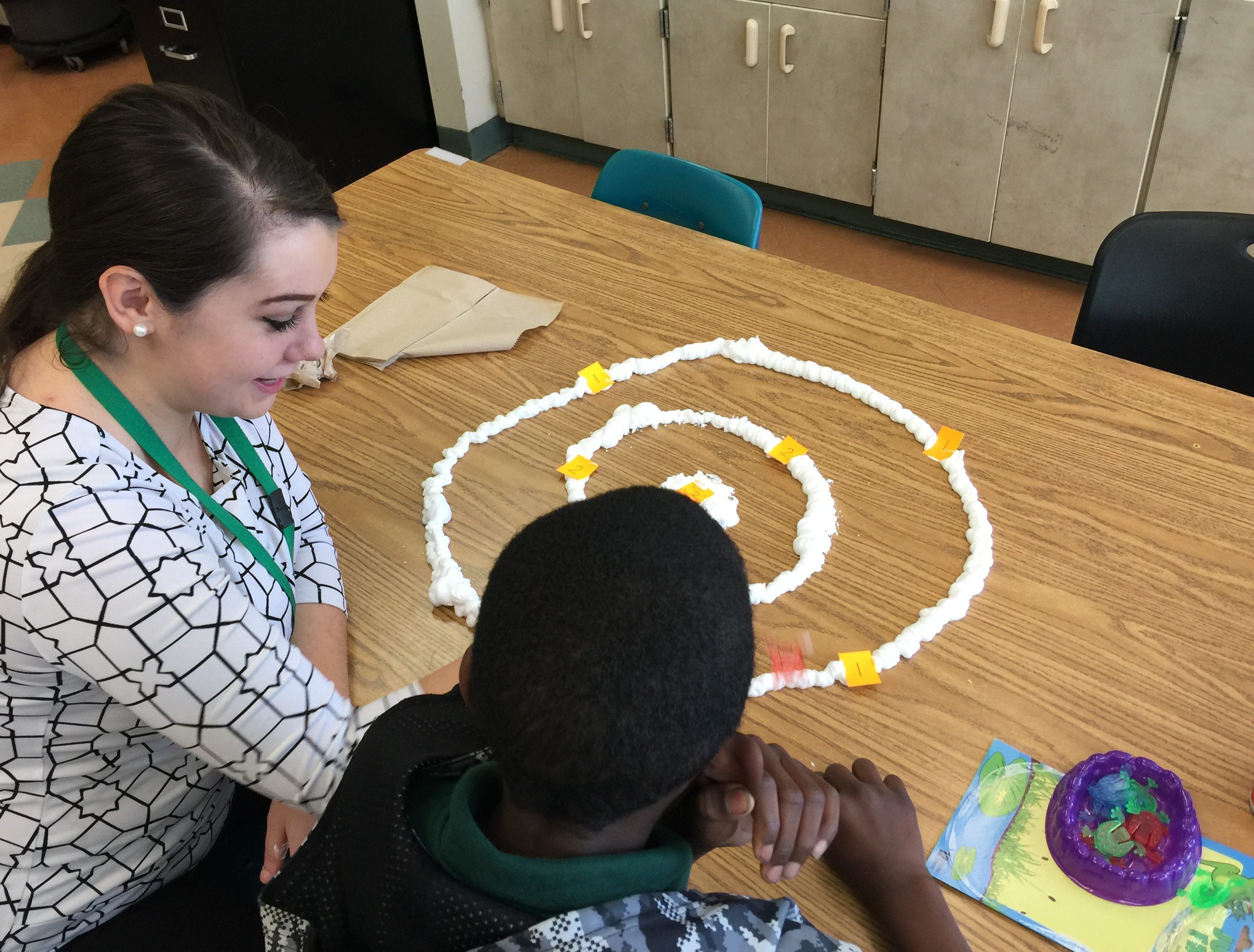 An MS SLP student works with a student at the GRASP Academy.