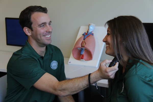 Two students practicing speech therapy.