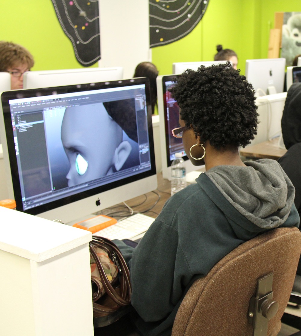 Student using software on a computer to animate.