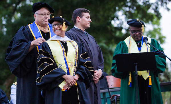 A student graduating with their doctorate.