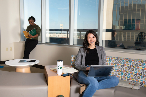 Two students studying in a common area.