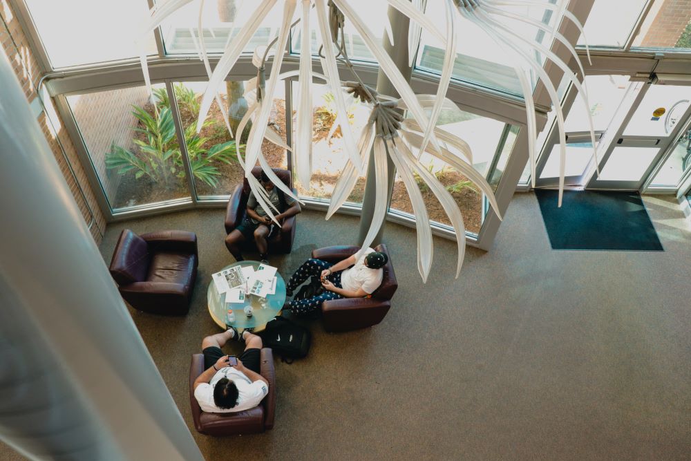 Aerial view of foyer with windows