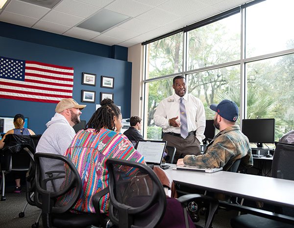 Students meeting in the Defender's Den, located in the Founders Building.