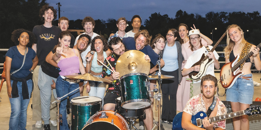 Students with instruments onstage at the Strom Amphitheater