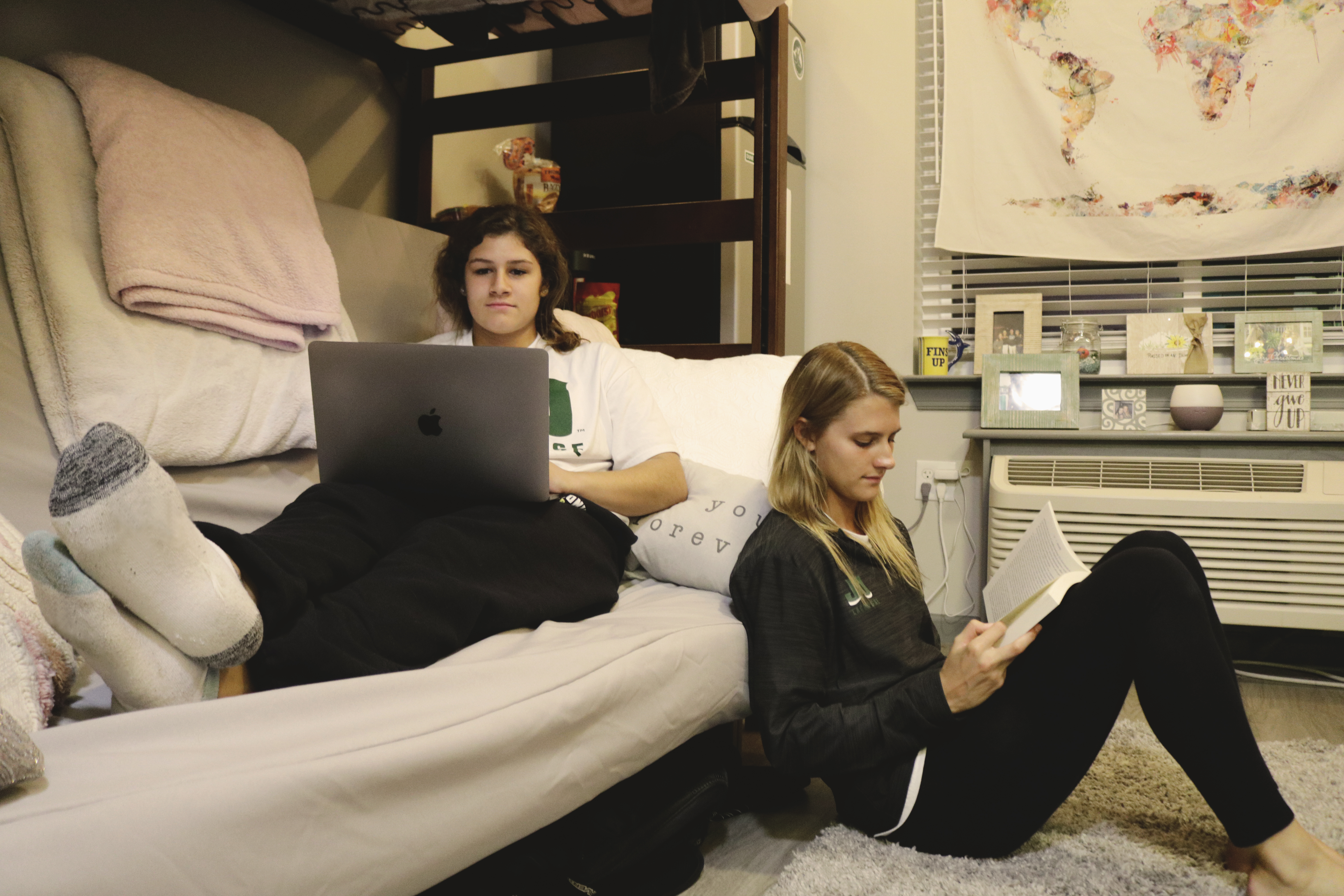 Students sitting inside dorm room