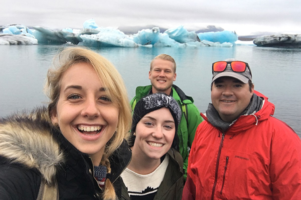 Students posing for a selfie while studying abroad in Iceland.