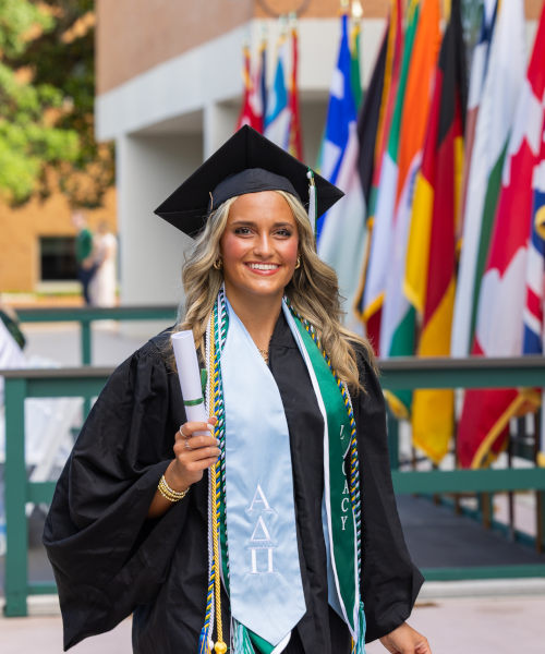 A student dressed in graduating regalia during Commencement Ceremony.