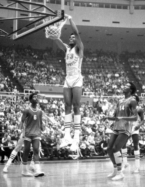 Artis Gilmore at a basketball game, performing a two-point field goal.