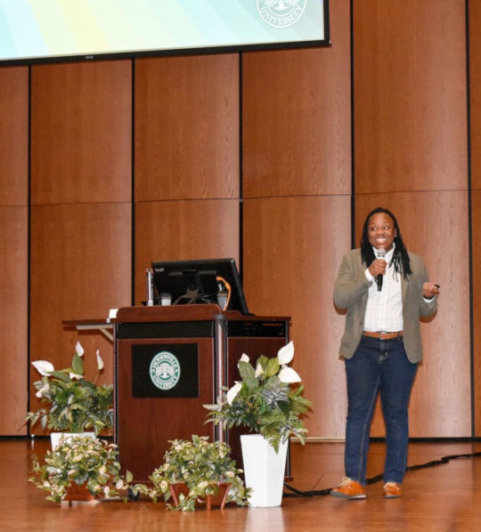 JU alumni delivering a speech at 2024 Dolphin Talks