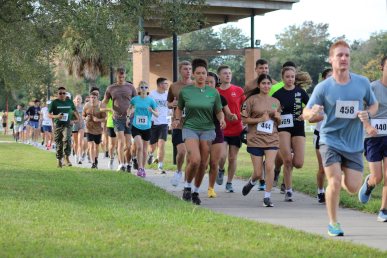 a group of people running a 5k marathon